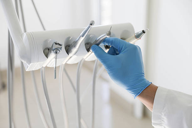 Professional Tooth Extraction technician working in East Islip, NY
